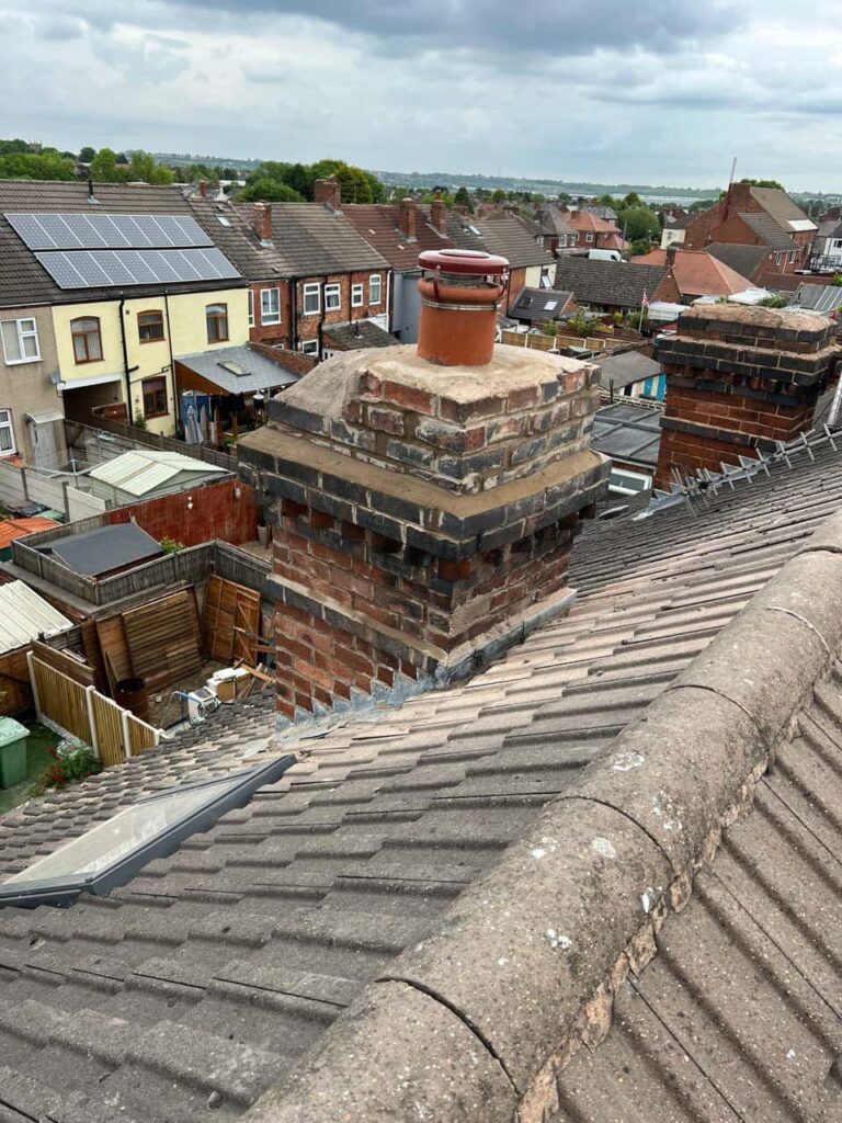 This is a photo taken from a roof which is being repaired by Alfreton Roofing Repairs, it shows a street of houses, and their roofs